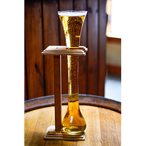 The Yard of Ale restaurant takes its name from a drinking glass, also known as a yard of ale. The glass featured a bulbous bottom and a long flute. It was designed to be long enough to pass up to stage coach drivers looking for a drink, and to hold enough beer to get them to their next destination.