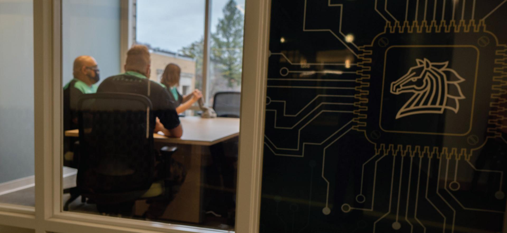 Members of the SUNY Morrisville esports team gather in a conference room located in Charlton Hall, the future home of the college’s esports arena.