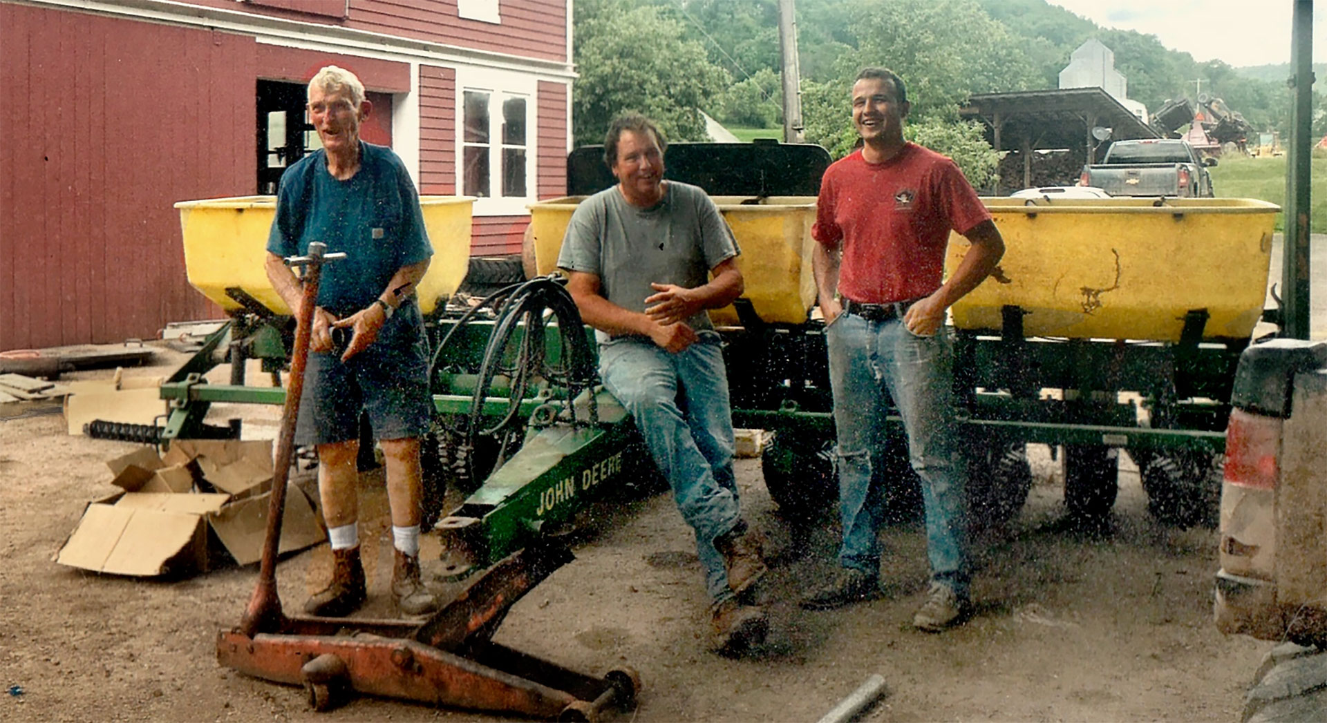 Kyle with his father and grandfather on the family farm