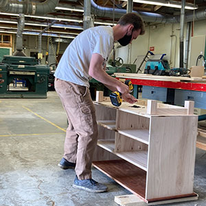 A student in a wood products technology class works on a project.