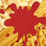 Three different shapes of pasta with red sauce splattered on top