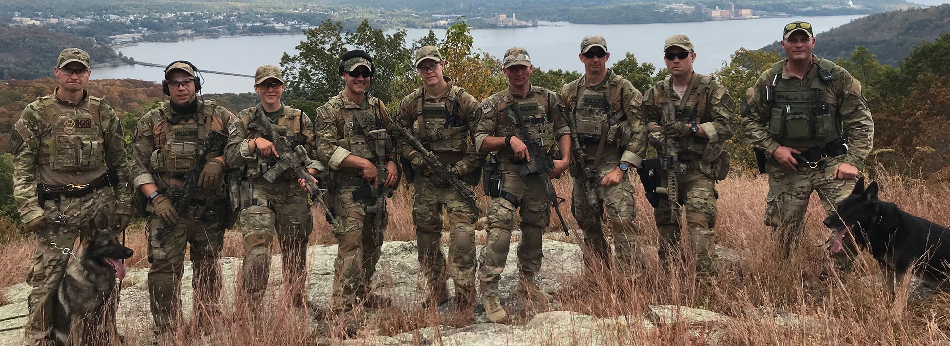 Justanna Bohling is pictured with her fellow Special Operations Group following a mission to search for a fugitive wanted for murder.