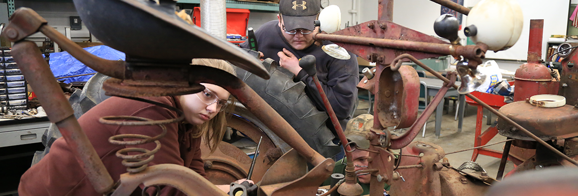 Students working on a tractor