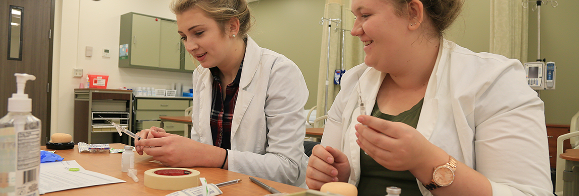 Students working with syringes