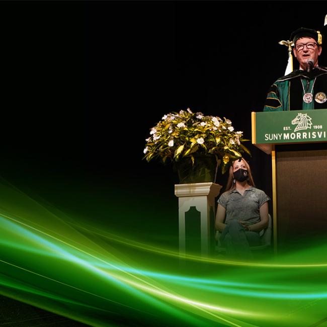 President David E. ROgers presides over a 2021 academic celebration ceremony