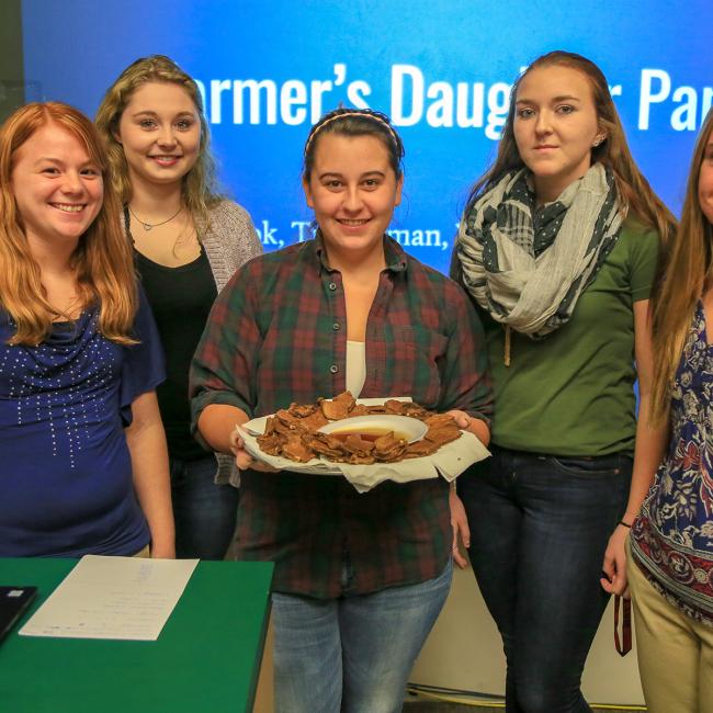 Agricultural business students present their product, The Farmer’s Daughter, a pancake mix. Pictured, from left: Vicki Grey, of Cattaraugus; Libby Snyder, of Scottsville, Leah Vancour, of Vernon, Connecticut; Ty Rodman, of Van Etten; and Grace Book, of Bliss.  