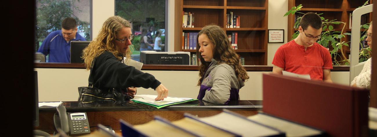 An incoming Norwich student receives assistance at Accepted Student Day.