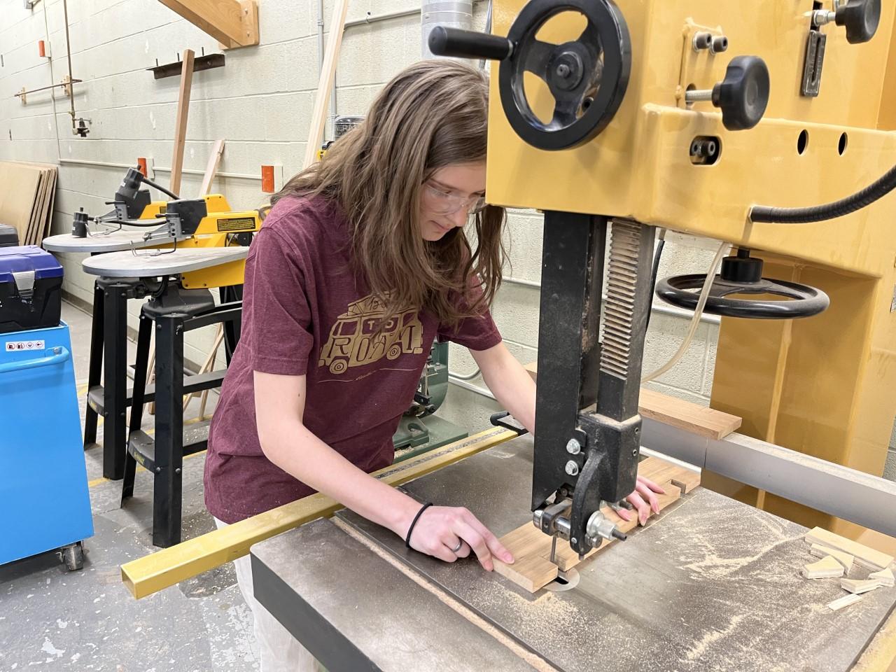 Student works on wood joinery system in wood construction lab-spring 2023