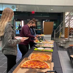 Norwich students enjoy pizza sponsored by the Norwich Campus Activity Board (N-CAB).