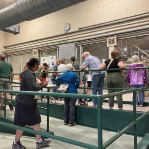 Community members enjoy a tour of the milking parlour during Open Farm Day at SUNY Morrisville