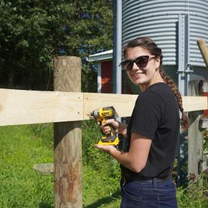 Student Carriane Bush worked with and took care of the goats at the Groves barn as par of a summer internship.